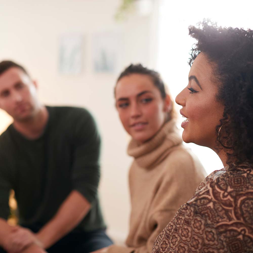 Woman speaking in a support group