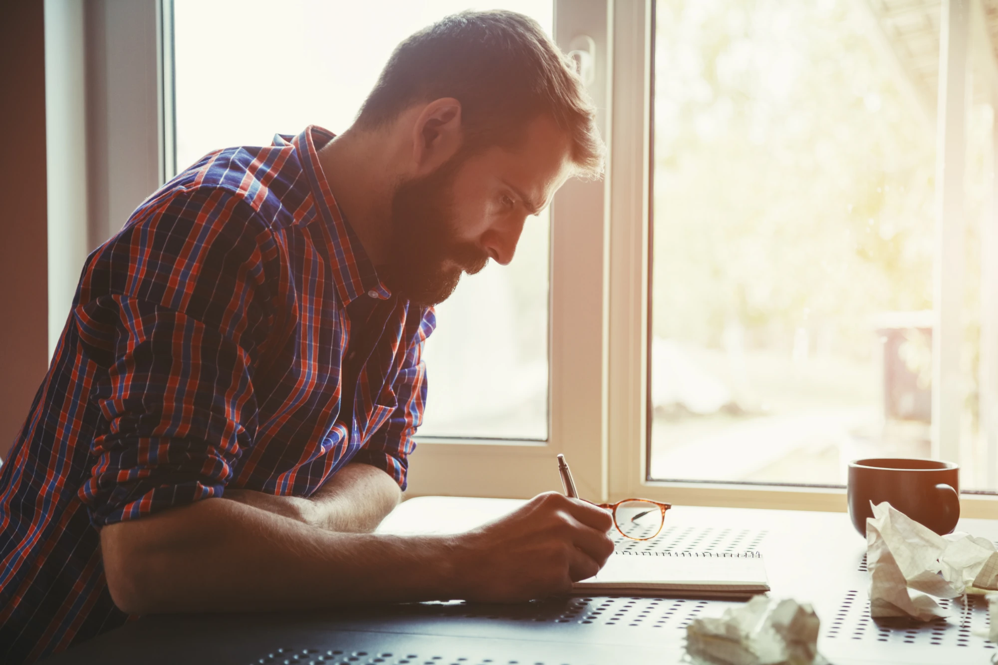 Person reviewing rehab cost and insurance coverage details at home